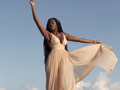 full-shot-greek-goddess-posing-beach-min
